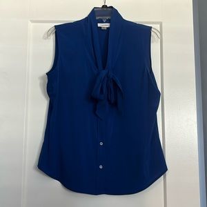 Bright blue sleeveless blouse